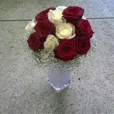 Rose and gypsophilia vase arrangement